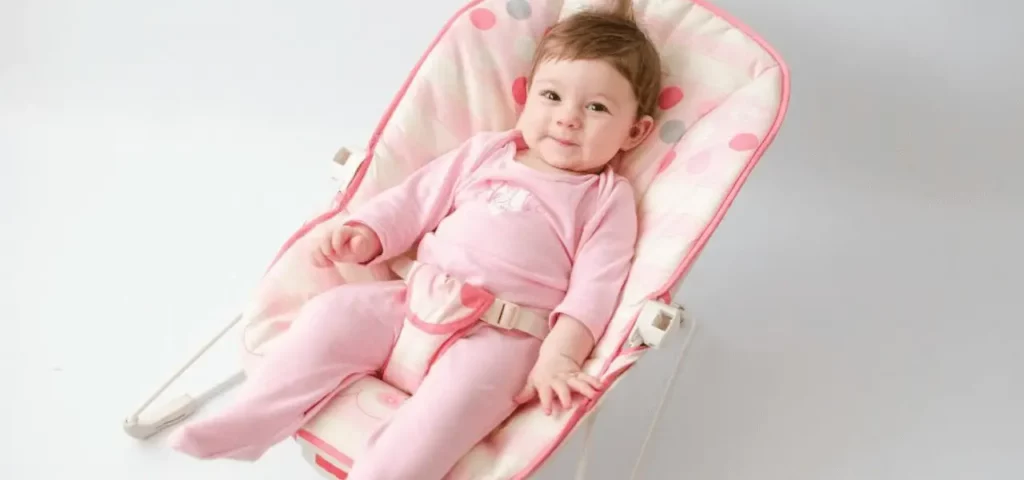 baby on pink swing