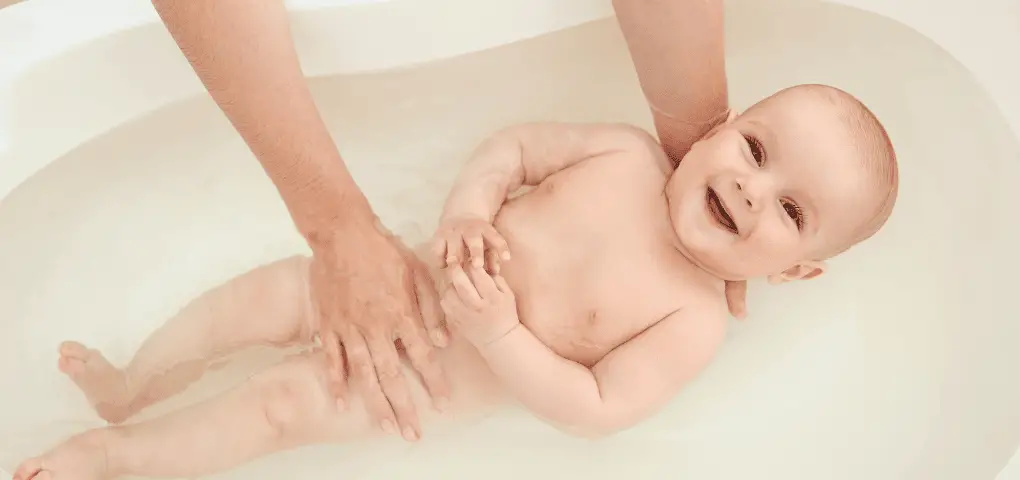 bathing baby on a bathtub