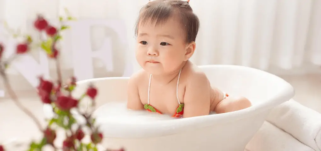 cute baby on bathtub