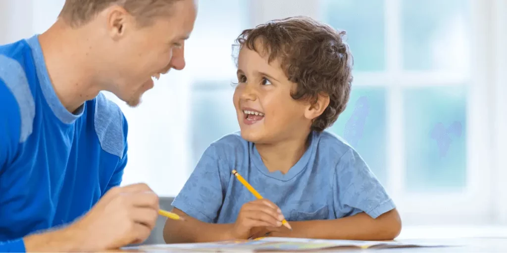 dad and son writing_at home preschool schedule