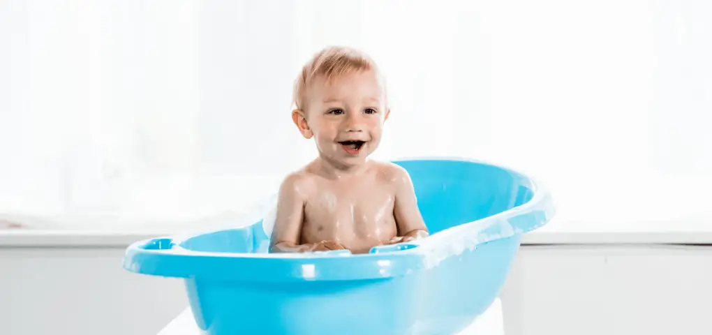 happy baby on a bathtub
