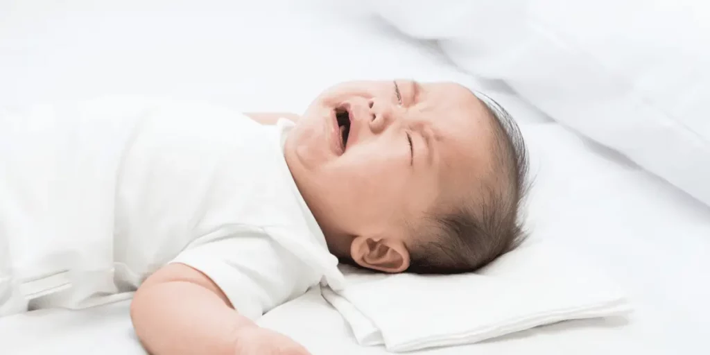 baby crying in bed