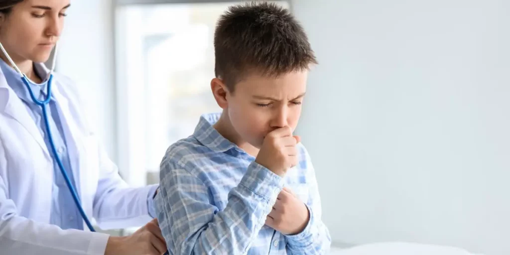 coughing boy in the doctor