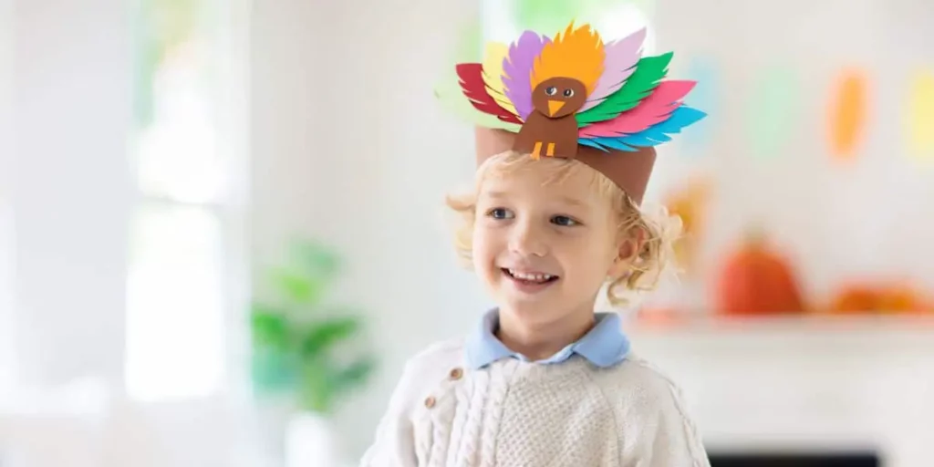 kid with turkey hat