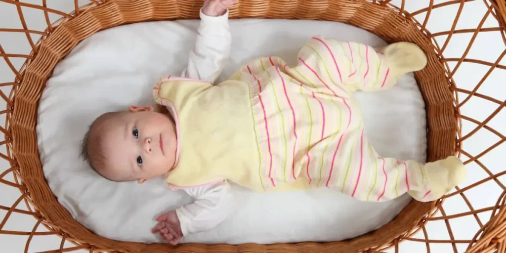 baby in wick bassinet
