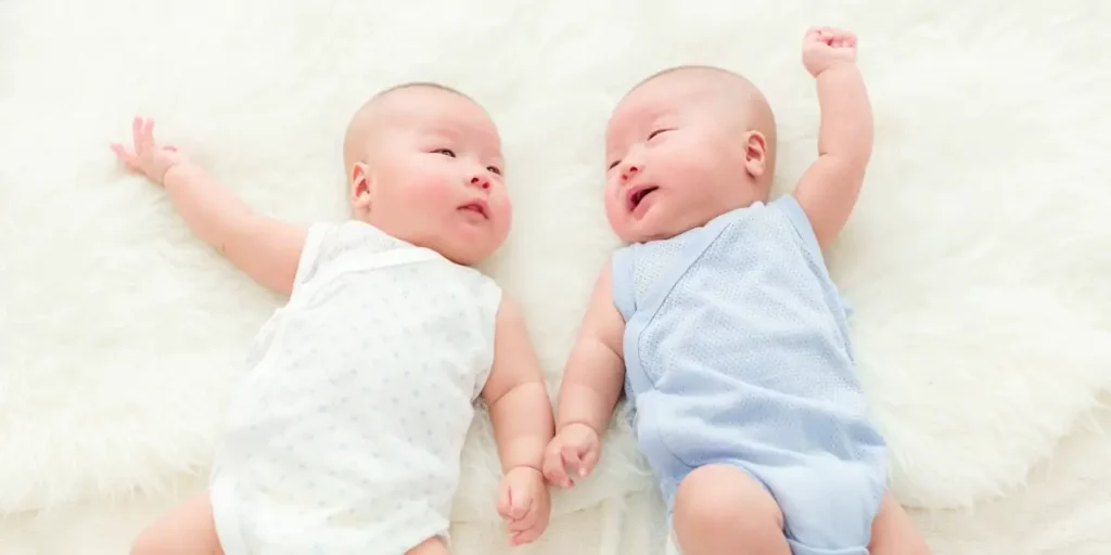 twin babies lying down