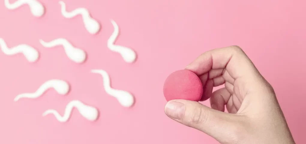 illustration of sperms swimming toward an egg