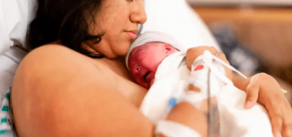 mom holding her infant after delivery